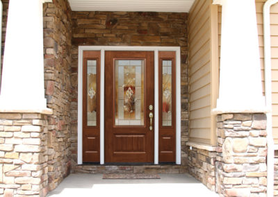 Oak Entry Door with Sidelights on Stone Facade