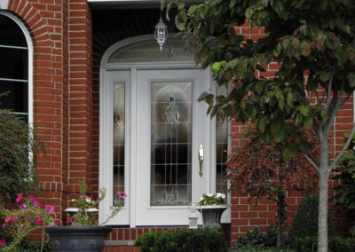 White Entry Door with Sidelight on Brick Home